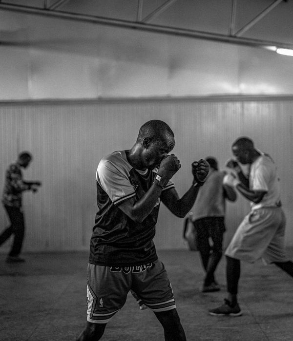 Man practicing gentle cardio movements in a bright room